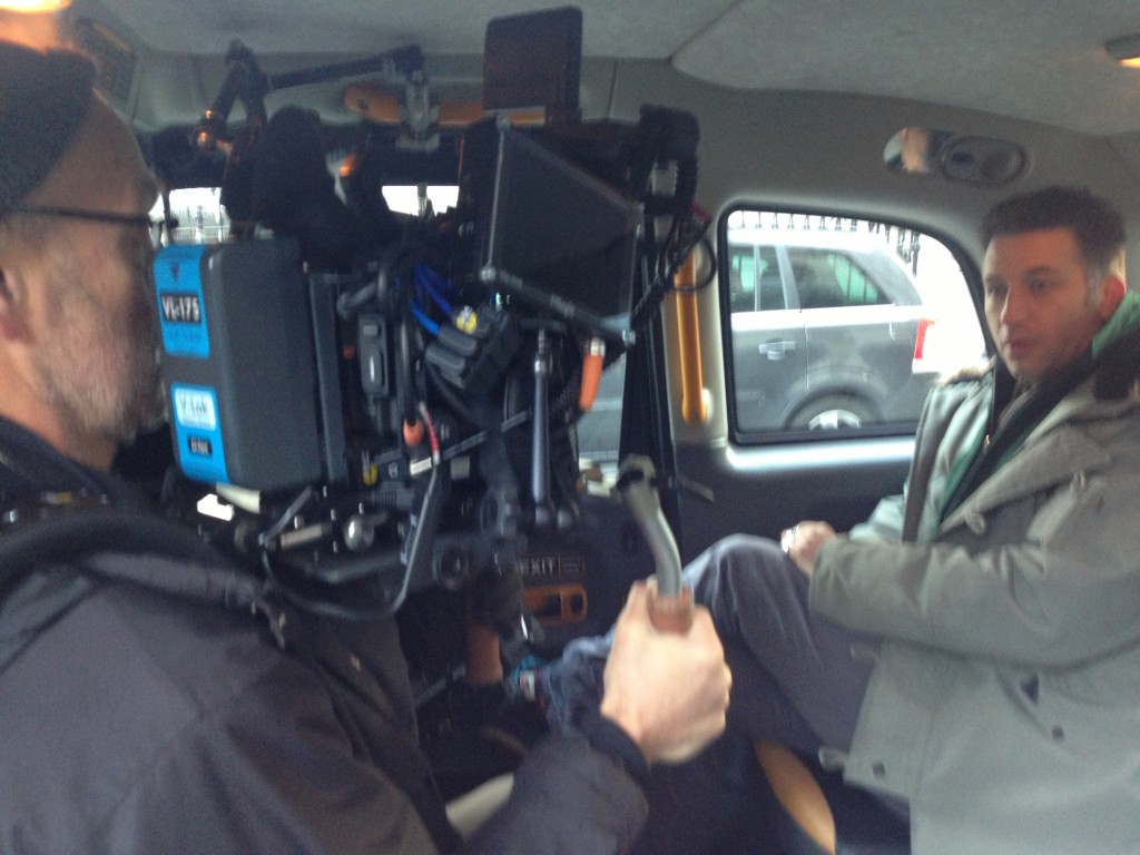 Optomen cameraman Steve and presenter Remy as they film footage inside one of our London Black Taxis